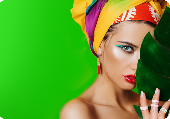 a woman in a scarf is hiding behind a leaf