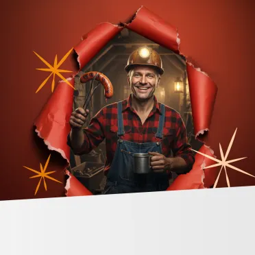 górnik z kiełbasą w ręce